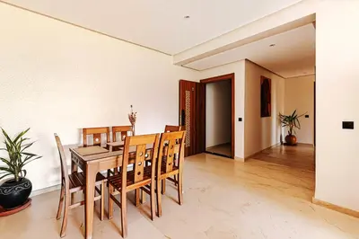 a dining room with a table and chairs at Rent Appartment In Marrakesh - Morocco - Semlalia in Marrakech