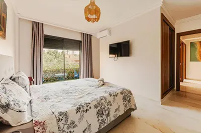 a bedroom with a bed and a window at Rent Appartment In Marrakesh - Morocco - Semlalia in Marrakech