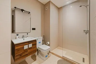 a bathroom with a toilet and a sink and a shower at Rent Appartment In Marrakesh - Morocco - Semlalia in Marrakech