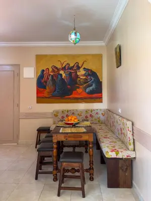 a living room with a couch and a table at Appartement lumineux avec Jardin à la palmeraie in Marrakech