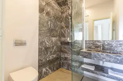 a bathroom with a shower with a toilet and a sink at Villa Seyana 1 Zero Vis a Vis et Piscine Chauffee in Marrakech
