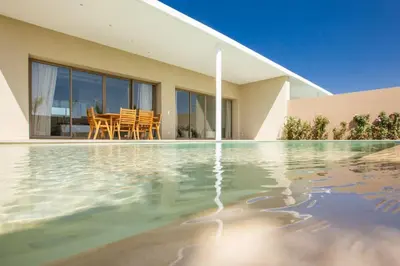 a house with a swimming pool in front of a house at Villa Seyana 2 Zero vis a vis, Piscine Chauffee in Marrakech