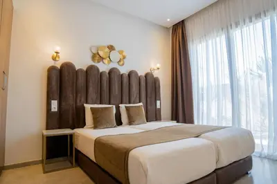 a bedroom with a large bed with a large headboard at Villa Seyana 5 Zero vis a vis Piscine chauffee in Marrakech