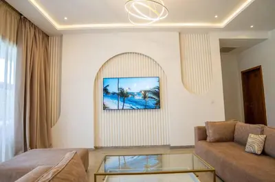 a living room with a couch and a glass table at Villa Seyana 5 Zero vis a vis Piscine chauffee in Marrakech