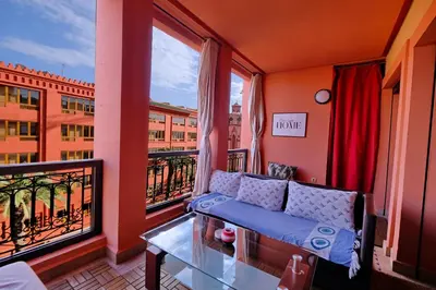 a living room with a couch on a balcony at DannaMs Apartment MohamedV Hivernage in Marrakech