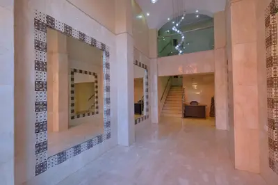 a hallway of a building with tile on the walls at DannaMs Apartment MohamedV Hivernage in Marrakech