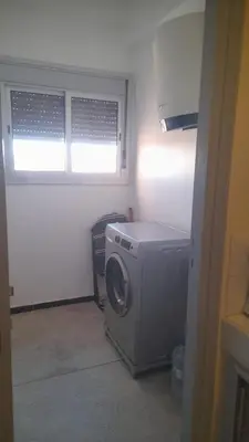a washing machine in a room with a window at Bahiya in Marrakech