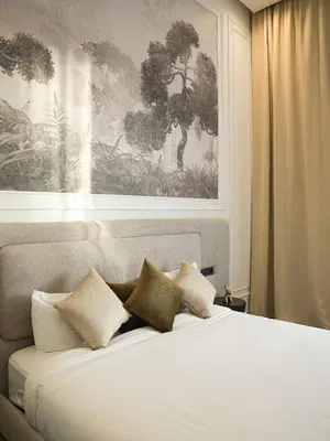 a bedroom with a bed with two pillows on it at Villa Crystale - Marrakech in Marrakech
