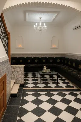 a waiting room with a couch and a table at Riad Nahara in Marrakech