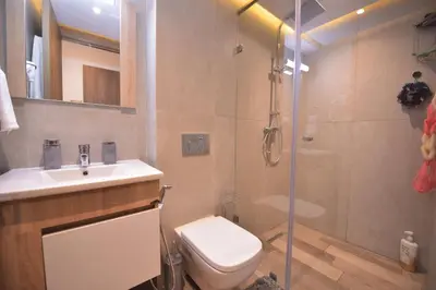 a bathroom with a shower and a toilet and a sink at Appart Essalam in Marrakech