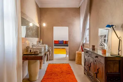 a bathroom with a sink and a mirror at Riad Litote in the heart of the Kasbah in Marrakech