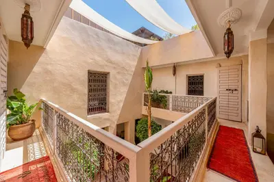 an indoor hallway with a staircase with an arched ceiling at Riad Litote in the heart of the Kasbah in Marrakech