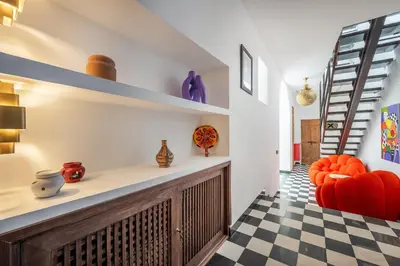 a living room with a checkered floor at Riad LILIA in Marrakech