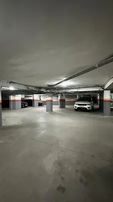 an empty parking garage with a car parked in it at Chic Stay in Gueliz 2, Parking sur place, Netflix in Marrakech