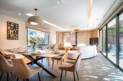 a dining room with a table and chairs at Villa Syria Marrakech Amelkis 3 in Marrakech