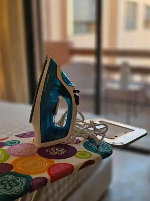 a small iron sitting on top of a table at Appartement Gueliz Haut de gamme Residence 5 piscines in Marrakech