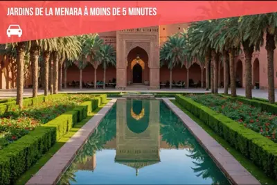 a view of a courtyard in a building with a fountain at Menara Garden Cosy Appartement Hivernage Marrakech in Marrakech