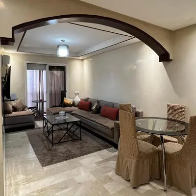 a living room with a couch and a glass table at Marrakech Family Stay City Center in Marrakech