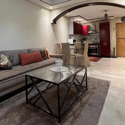 a living room with a couch and a glass table at Marrakech Family Stay City Center in Marrakech
