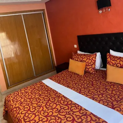 a hotel room with a large bed in a room at Marrakech Family Stay City Center in Marrakech