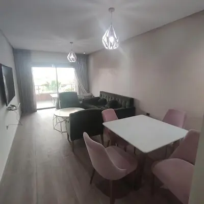 a waiting room with chairs and tables and a couch at T3 Jade Prestigia Pool in Marrakech