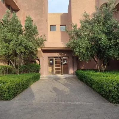 a building with a walkway in front of a building at T3 Jade Prestigia Pool in Marrakech