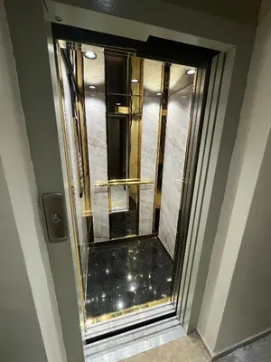 a glass door of a elevator in a building at Dar alya in Marrakech