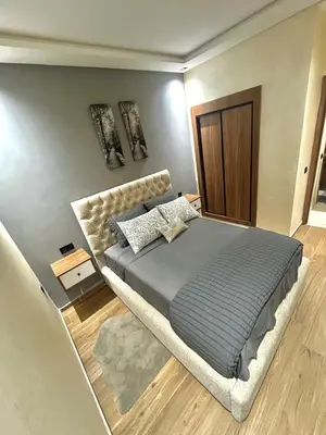 a bedroom with a large bed in a room at Dar alya in Marrakech