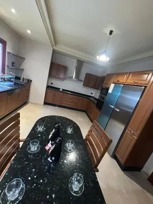 a kitchen with a table with wine glasses on it at Royal Arabian Night in Marrakech