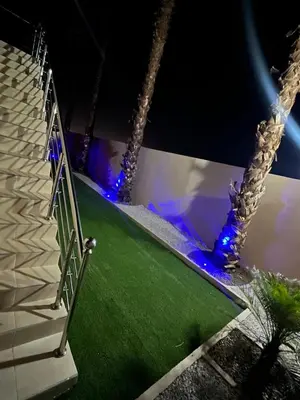 a set of stairs with blue lights on a stage at Villa Marrakech DAR JAHYR in Douar Ouled Ahmed