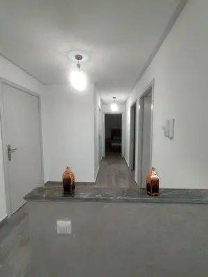 an empty room with white walls and a hallway at 2-bedroom apartment in Marrakech