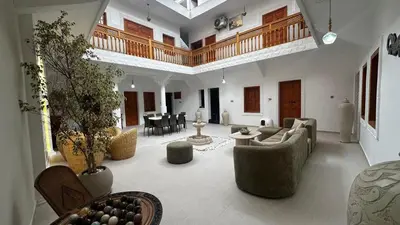 a large living room with couches and chairs at Riad Dari and spa - 8 ROOMS EXCLUSIVITY in Marrakech