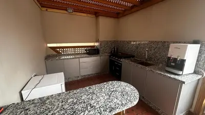 a kitchen with a stove and a counter top at Riad Dari and spa - 8 ROOMS EXCLUSIVITY in Marrakech