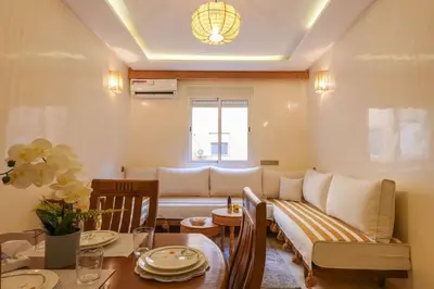 a living room with a couch and a table at NS 51 by KMREI Properties in Marrakech