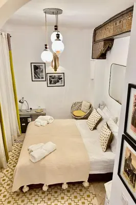 two beds in a room with two towels on them at Riad Bab Sitiyn Hammam & Spa in Marrakech