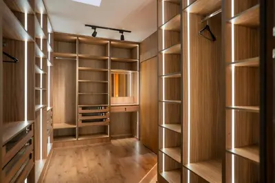 a walk in closet with wooden shelves at Villa Akenza - Cinema - Swiming pool in Marrakech