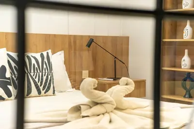 a towel animal sitting on top of a bed at Luxurious apartment ,hot tub in Marrakech