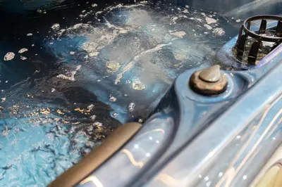 a close up of a stove top with blue water at Luxurious apartment ,hot tub in Marrakech