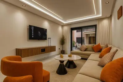a living room with a couch and a tv at Stylish Hivernage Studio in Marrakech