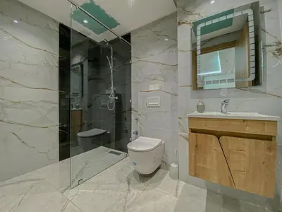 a bathroom with a toilet and a sink and a shower at Stylish Hivernage Studio in Marrakech