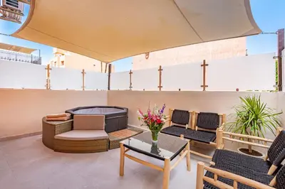 a patio with furniture and a fire pit on a building at NOUVEAU à Marrakech in Marrakech