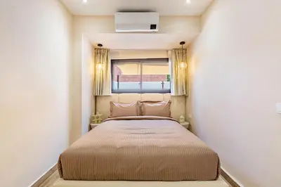 a bed in a small room with a window at NOUVEAU à Marrakech in Marrakech