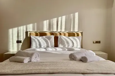 a bedroom with a bed with towels on it at Top floor apartment in Gueliz with Balcony in Marrakech