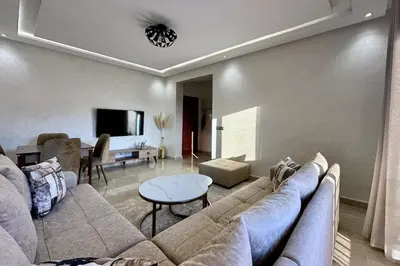 a living room with a couch and a table at Top floor apartment in Gueliz with Balcony in Marrakech