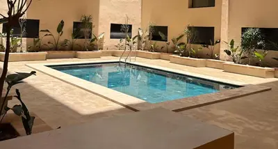 a swimming pool in the middle of a house at Marrakech Éternel - Hivernage in Marrakech