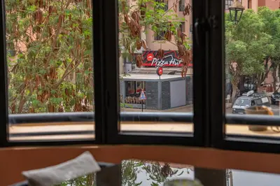 a view of a city street from a window at Marrakech GUELIZ Vue Imprenable et Terrasse rare in Marrakech