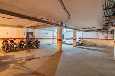 a parking garage with a car parked in it at Marrakech GUELIZ Vue Imprenable et Terrasse rare in Marrakech