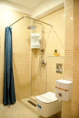 a bathroom with a shower with a toilet and a glass shower at Regine in Marrakech
