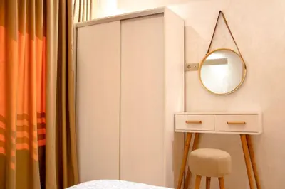 a bedroom with a white cabinet and a mirror at Regine in Marrakech