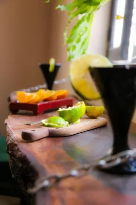 a cutting board with citrus fruits on a table at DAR MA ITTO Charming luxurious Medina Cocoon in Marrakech